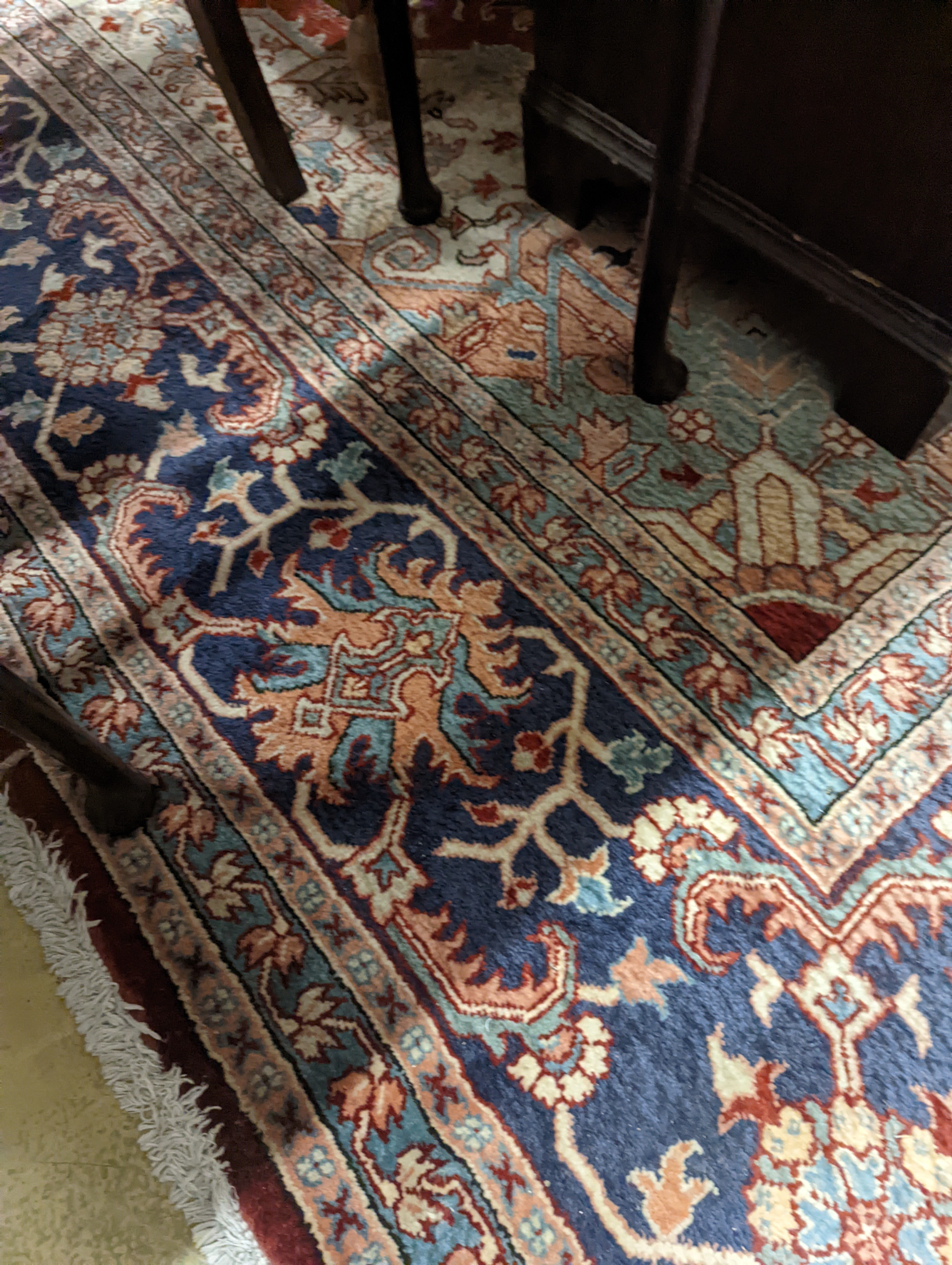 A large Caucasian style red ground carpet, 460 x 330cm